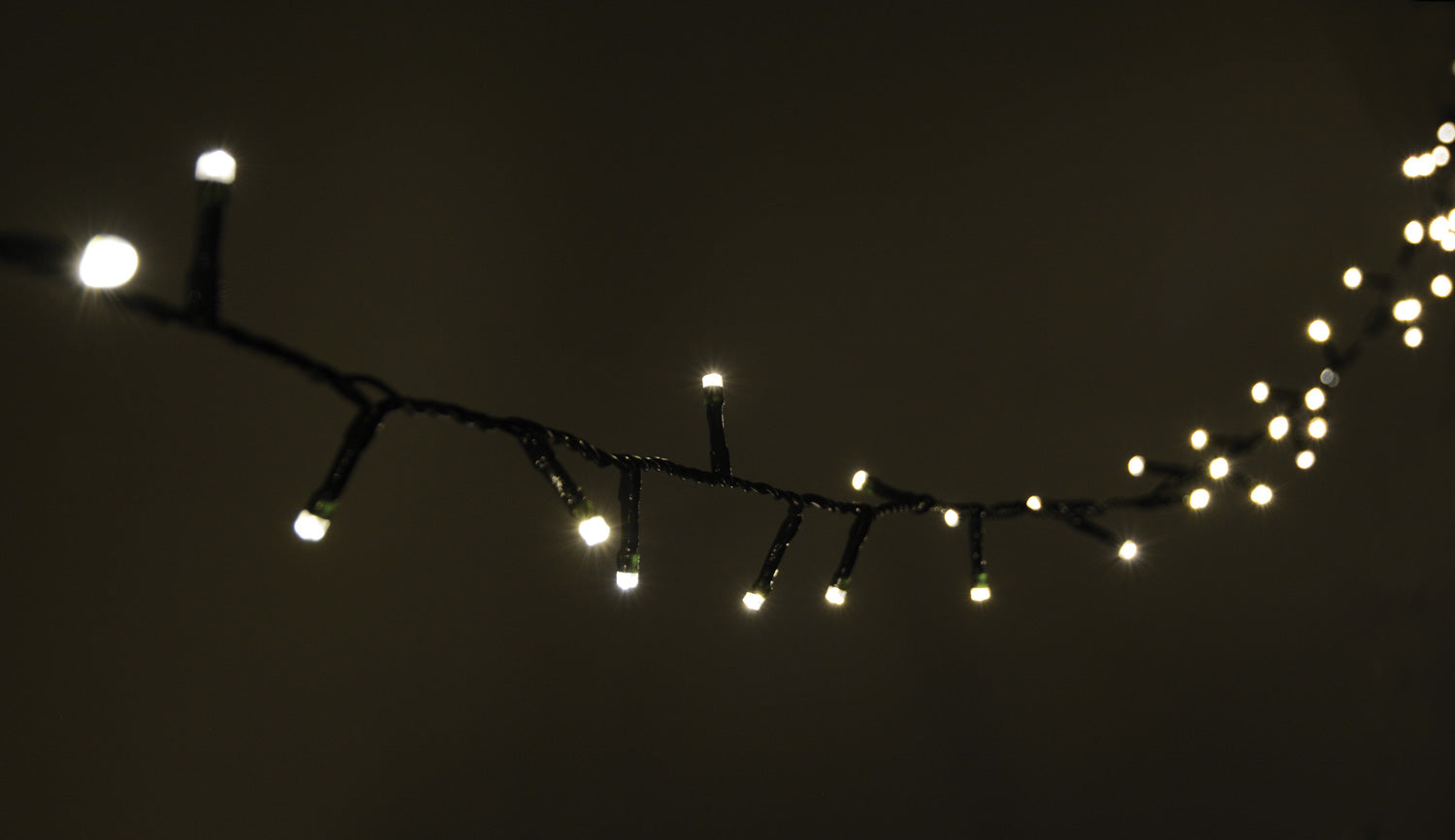 LYYT: 155.465UK, 200 LED Indoor/Sheltered Outdoor String Lights, 10m, Warm White, 24-Hour Timer, Dark Green Cable